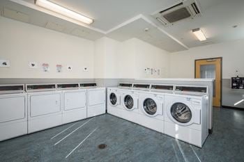 Central laundry facility with card operated machines